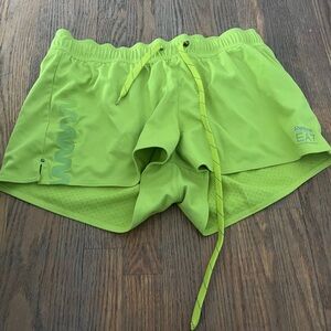 Reebok women’s neon green athletic shorts, size medium.